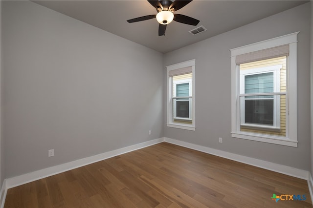 645 Center Grn, New Braunfels, TX 78130 - spare room featuring baseboards, visible vents, ceiling fan, and dark wood-type flooring