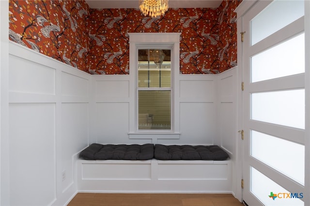 645 Center Grn, New Braunfels, TX 78130 - mudroom with an inviting chandelier, a decorative wall, a wainscoted wall, wallpapered walls, and wood finished floors