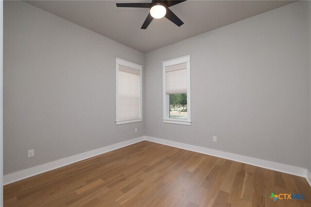 645 Center Grn, New Braunfels, TX 78130 - spare room with baseboards, a ceiling fan, and wood finished floors