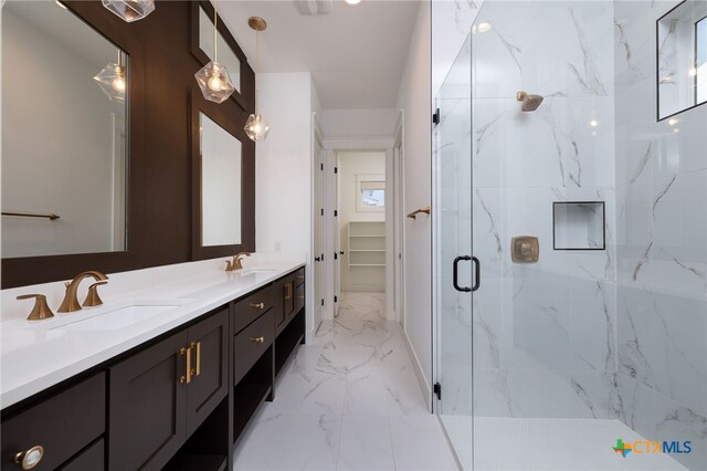 645 Center Grn, New Braunfels, TX 78130 - full bathroom featuring a sink, a marble finish shower, double vanity, and marble finish floor