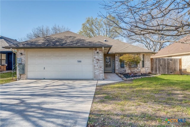 ranch-style house with fence, driveway, a shingled roof, a front lawn, and a garage