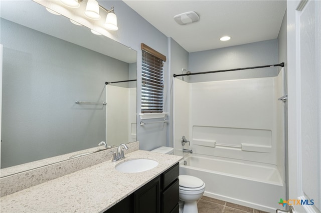 full bathroom with toilet, tile patterned flooring, vanity, and washtub / shower combination