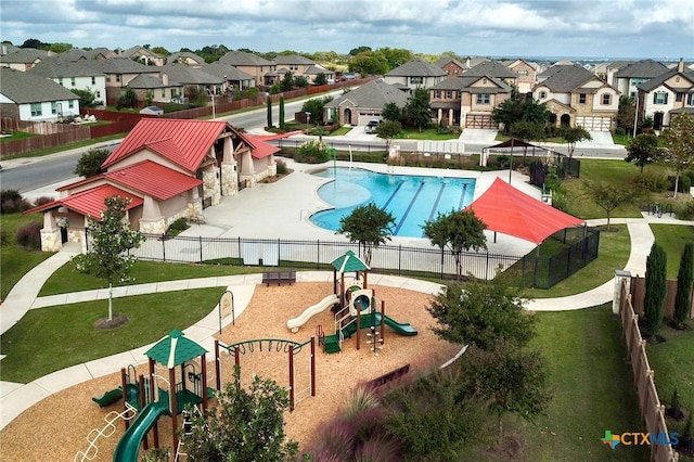 exterior space featuring a playground, a lawn, and a patio