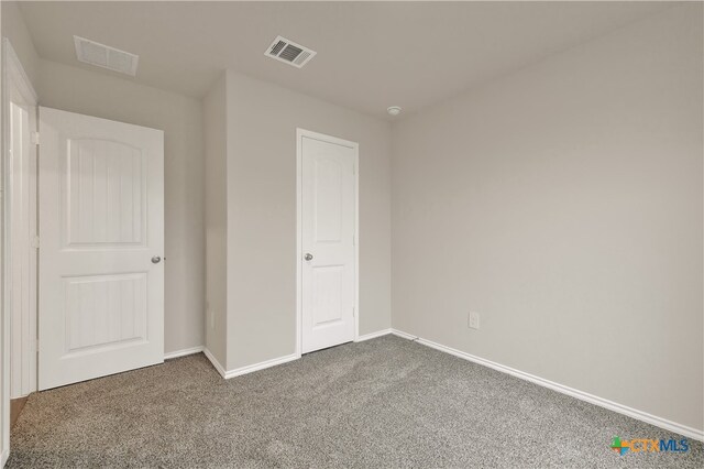 unfurnished bedroom featuring carpet flooring