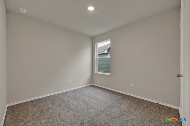 unfurnished room with carpet flooring