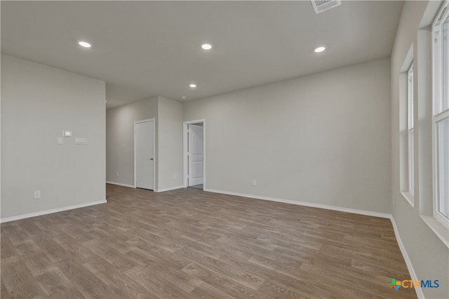 unfurnished room featuring light hardwood / wood-style flooring