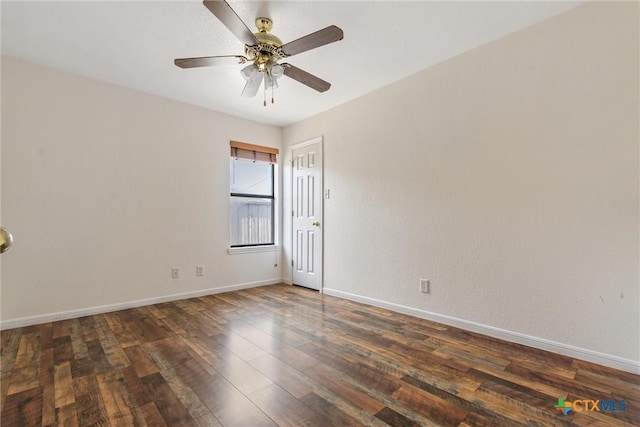 spare room featuring a ceiling fan, baseboards, and hardwood / wood-style floors