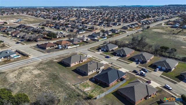 birds eye view of property with a residential view