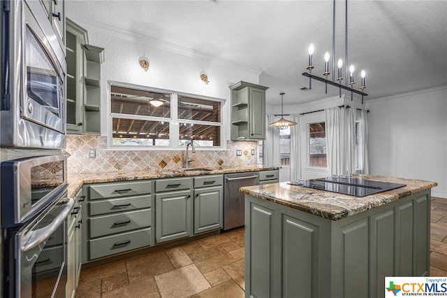 kitchen featuring appliances with stainless steel finishes, tasteful backsplash, ornamental molding, pendant lighting, and a kitchen island