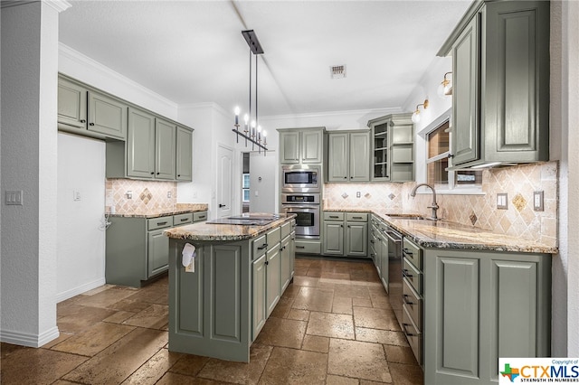 kitchen with sink, crown molding, decorative backsplash, a kitchen island, and stainless steel appliances