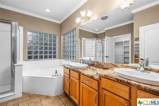 bathroom with a chandelier, vanity, independent shower and bath, and ornamental molding