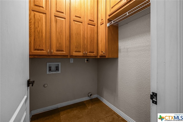 laundry area featuring cabinets, hookup for a washing machine, and electric dryer hookup