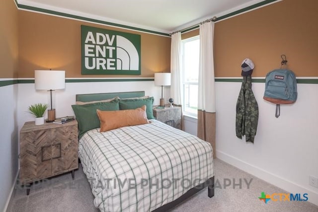 carpeted bedroom with baseboards