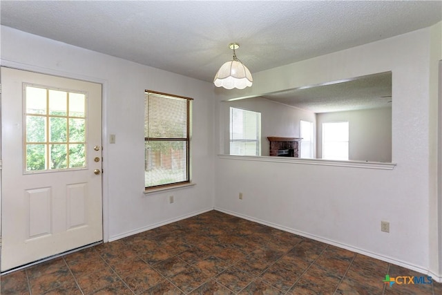 707 Bond St, Copperas Cove, TX 76522 - unfurnished dining area featuring a brick fireplace and baseboards