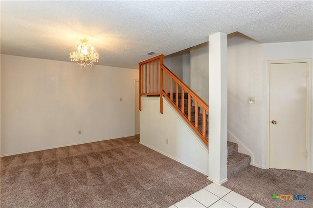707 Bond St, Copperas Cove, TX 76522 - basement with carpet floors, stairway, a textured ceiling, a chandelier, and tile patterned floors