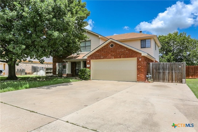 707 Bond St, Copperas Cove, TX 76522 - traditional home featuring brick siding, an attached garage, and driveway
