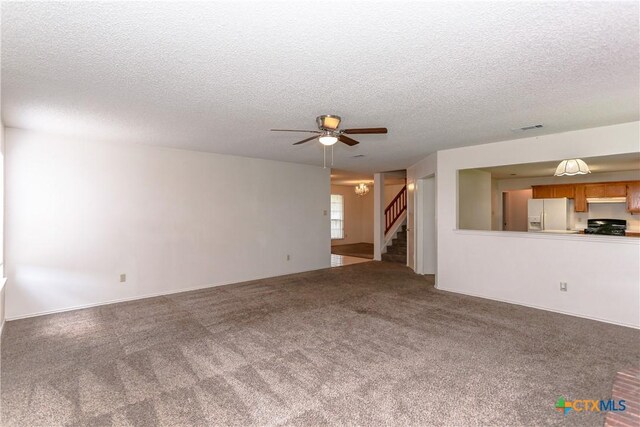 707 Bond St, Copperas Cove, TX 76522 - unfurnished living room featuring a textured ceiling, stairs, ceiling fan, and carpet