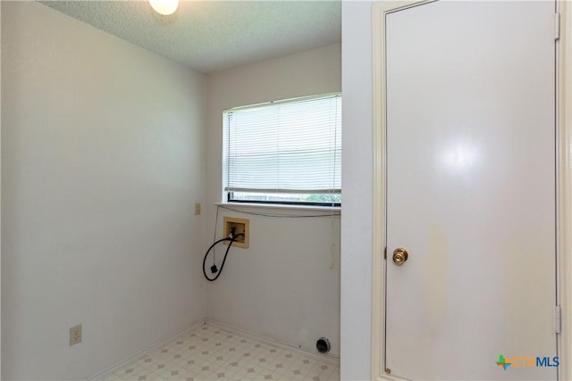 707 Bond St, Copperas Cove, TX 76522 - laundry room with hookup for a washing machine, light flooring, and a textured ceiling