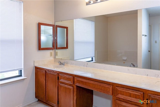 707 Bond St, Copperas Cove, TX 76522 - bathroom featuring a garden tub and vanity