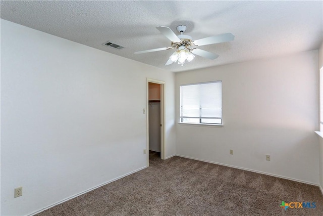 707 Bond St, Copperas Cove, TX 76522 - unfurnished bedroom featuring carpet flooring, ceiling fan, a textured ceiling, and a spacious closet