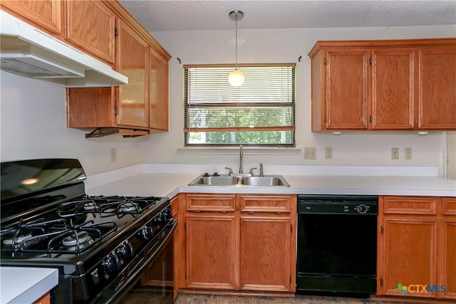707 Bond St, Copperas Cove, TX 76522 - kitchen featuring black appliances, under cabinet range hood, light countertops, pendant lighting, and brown cabinetry