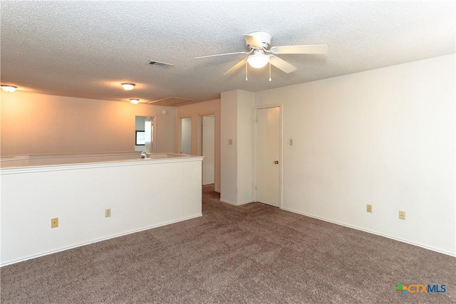 707 Bond St, Copperas Cove, TX 76522 - spare room with attic access, ceiling fan, carpet flooring, and a textured ceiling