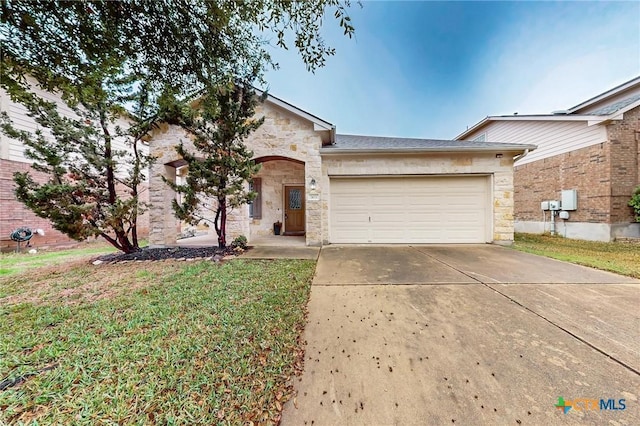 ranch-style home featuring a garage and a front yard