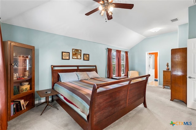404 N Austin St, Buda, TX 78610 - bedroom with vaulted ceiling, light colored carpet, and a ceiling fan