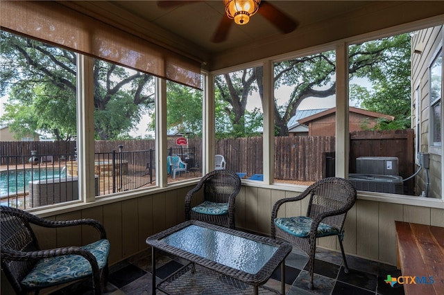 404 N Austin St, Buda, TX 78610 - sunroom / solarium featuring healthy amount of natural light and a ceiling fan