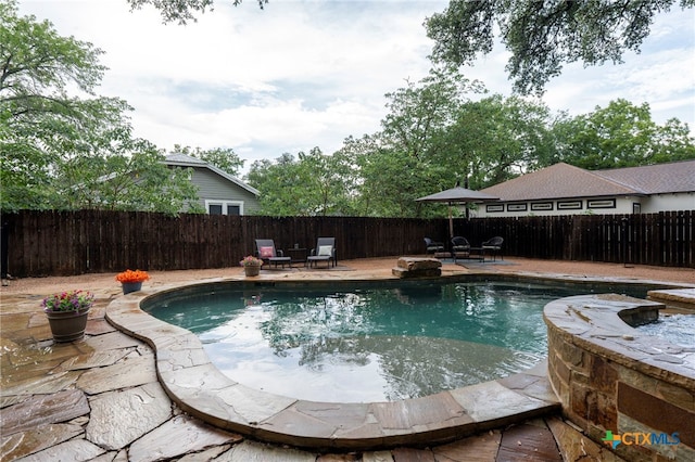 404 N Austin St, Buda, TX 78610 - view of swimming pool with a fenced backyard and a patio area