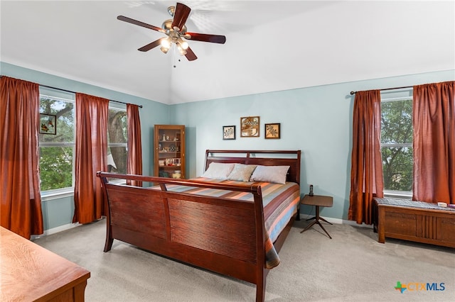 404 N Austin St, Buda, TX 78610 - bedroom featuring light colored carpet, vaulted ceiling, and ceiling fan