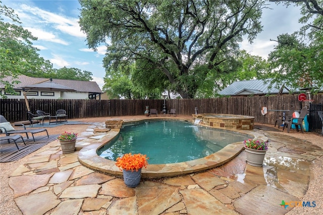 404 N Austin St, Buda, TX 78610 - view of swimming pool with a patio area, a fenced backyard, and an in-ground hot tub