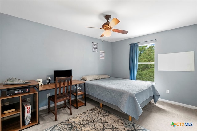 404 N Austin St, Buda, TX 78610 - carpeted bedroom featuring baseboards and ceiling fan