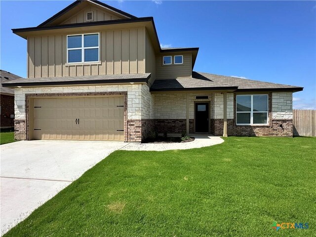 3005 Hedwig St, Killeen, TX 76549 - view of front of property featuring an attached garage, board and batten siding, concrete driveway, and brick siding
