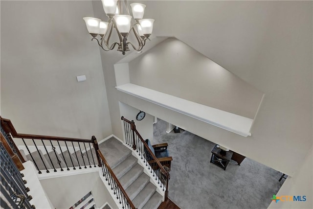 6333 Iris Run, New Braunfels, TX 78132 - stairway featuring a chandelier, lofted ceiling, and carpet floors