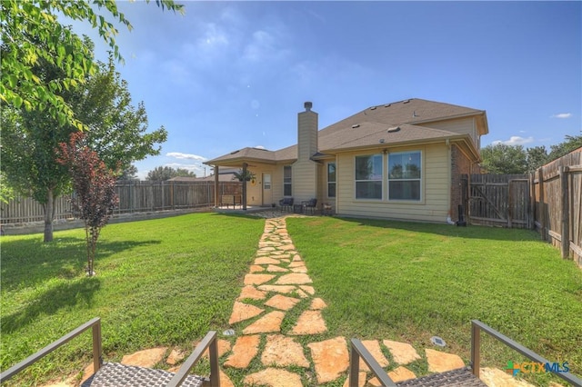 6333 Iris Run, New Braunfels, TX 78132 - rear view of house featuring a fenced backyard, a chimney, and a patio