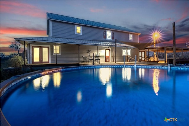 outdoor pool with french doors