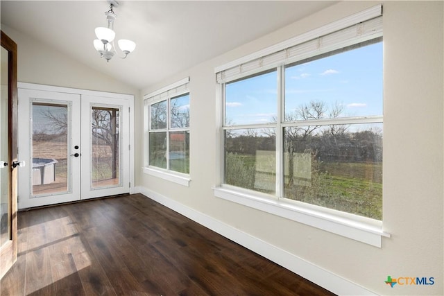 unfurnished sunroom with french doors, lofted ceiling, and an inviting chandelier