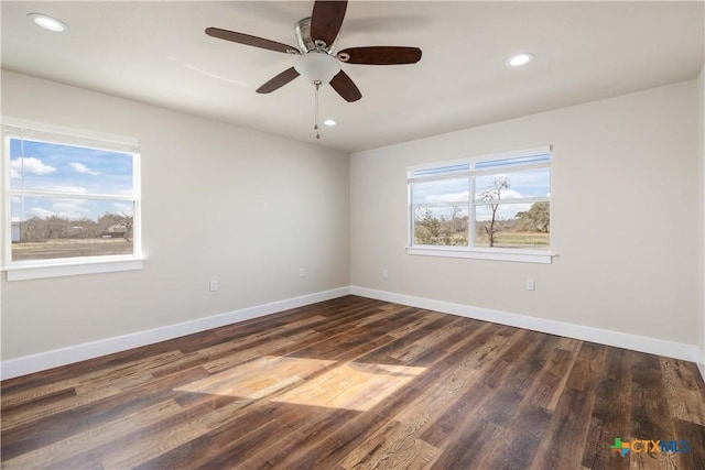 unfurnished room featuring recessed lighting, baseboards, and wood finished floors