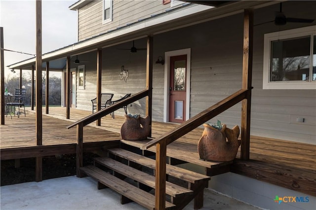 entrance to property with ceiling fan