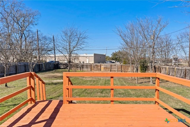 wooden terrace featuring a lawn