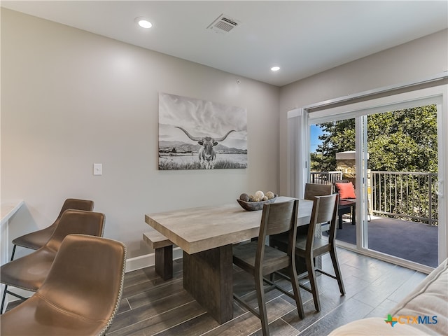 dining area featuring dark wood-type flooring