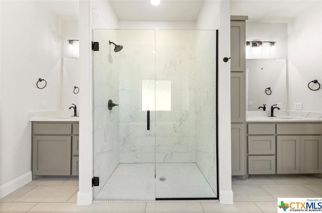 122 Overlook Trl, Copperas Cove, TX 76522 - bathroom with a marble finish shower, tile patterned flooring, vanity, and baseboards