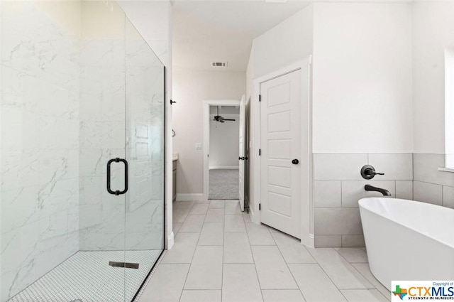 122 Overlook Trl, Copperas Cove, TX 76522 - bathroom with a stall shower, a soaking tub, tile patterned floors, and ceiling fan