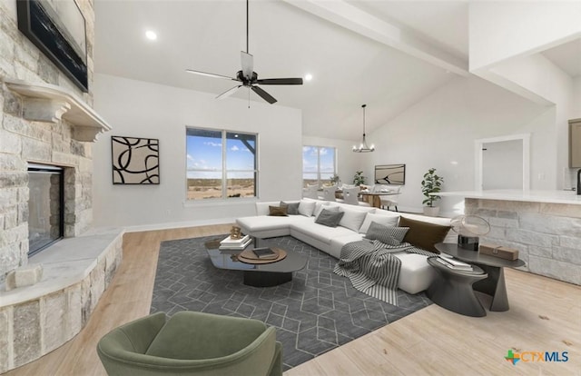 122 Overlook Trl, Copperas Cove, TX 76522 - living room with a fireplace, wood finished floors, a ceiling fan, beam ceiling, and high vaulted ceiling
