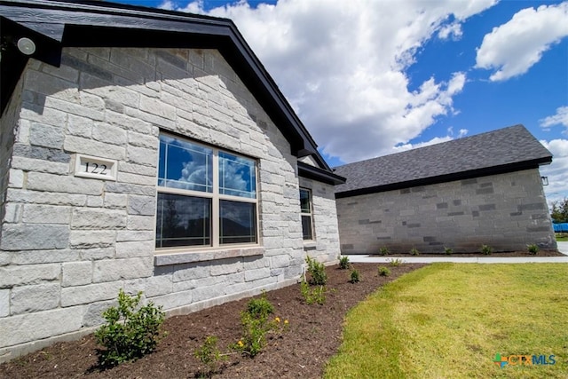 122 Overlook Trl, Copperas Cove, TX 76522 - view of side of property with stone siding and a lawn