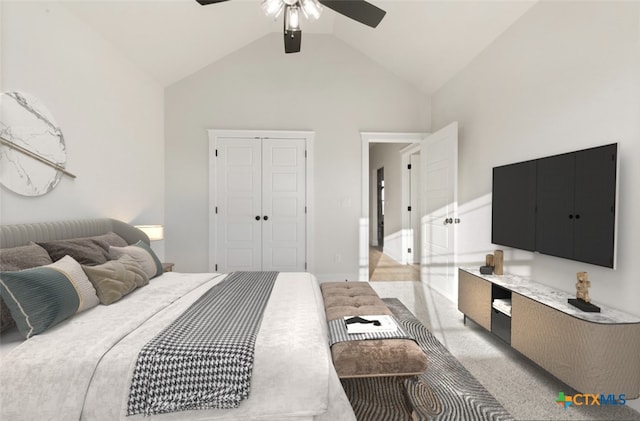 carpeted bedroom featuring ceiling fan, high vaulted ceiling, and a closet