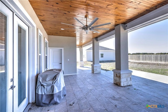 view of patio with a grill and ceiling fan