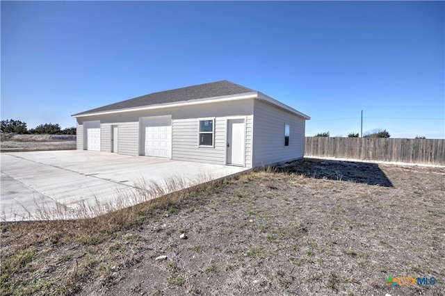 view of side of home with a garage