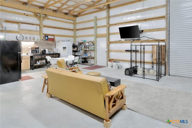407 W Oakland Ave, Seadrift, TX 77983 - living area featuring concrete flooring and lofted ceiling